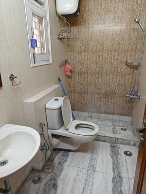 Bathroom in 1.5 BHK Builder Floor at East Of Kailash – for Rent