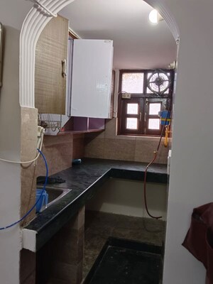 Kitchen in Studio Builder Floor at Amar Colony – for Rent