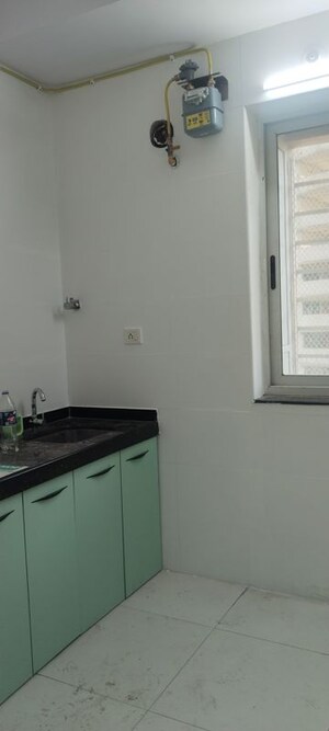 Kitchen in 2 BHK Apartment at Sheth Vasant Lawns, Laxmi Nagar – for Rent