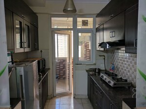 Kitchen in 2 BHK Apartment at Amrapali Silicon City, Sector 76 – for Rent
