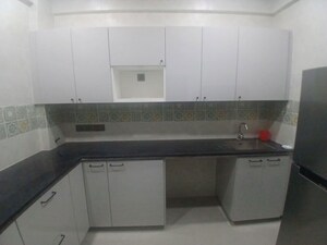 Kitchen in 1 BHK Apartment at Laxmi Chandra Niwas, Charni Road – for Rent