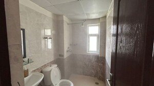 Bathroom in 3 BHK Apartment at Aims Golf City, Sector 75 – for Rent