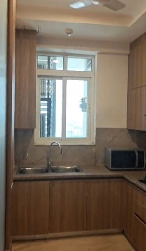 Kitchen in 2 BHK Apartment at Ambience Creacions, Sector 22 – for Rent