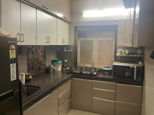 Kitchen in 2 BHK Apartment at Omkar Alta Monte, Malad East – for Rent