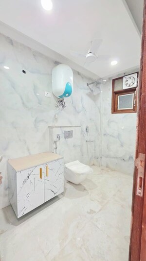 Bathroom in 4 BHK Builder Floor at Freedom Fighters Enclave – for Sale