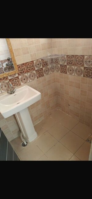 Bathroom in 3 BHK Builder Floor at Maan Heights, Gaur City 1 – for Rent