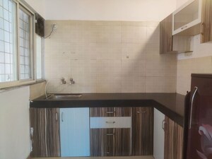 Kitchen in 2 BHK Apartment at AWHO Vijay Vihar, Wagholi – for Rent