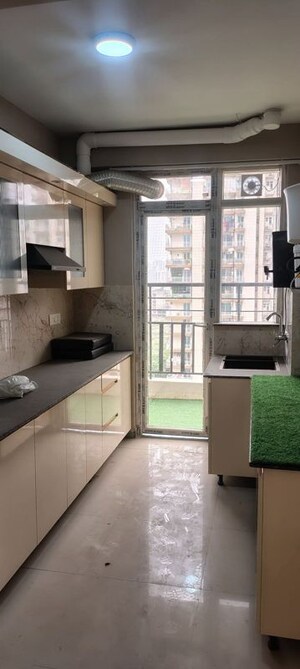 Kitchen in 3 BHK Apartment at Hawelia Valencia Homes, Sector 1 Greater Noida – for Rent