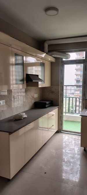 Kitchen in 3 BHK Apartment at Hawelia Valencia Homes, Sector 1 Greater Noida – for Rent