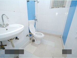 Bathroom in 2 BHK Apartment at Cosmos Golden Heights, Sain Vihar – for Sale