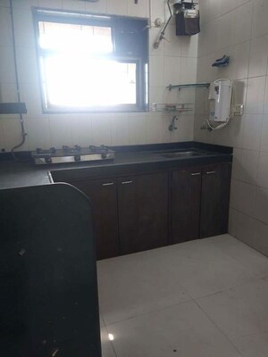 Kitchen in 3 BHK Apartment at Vaibhav Vilas CHS, Majiwada – for Rent