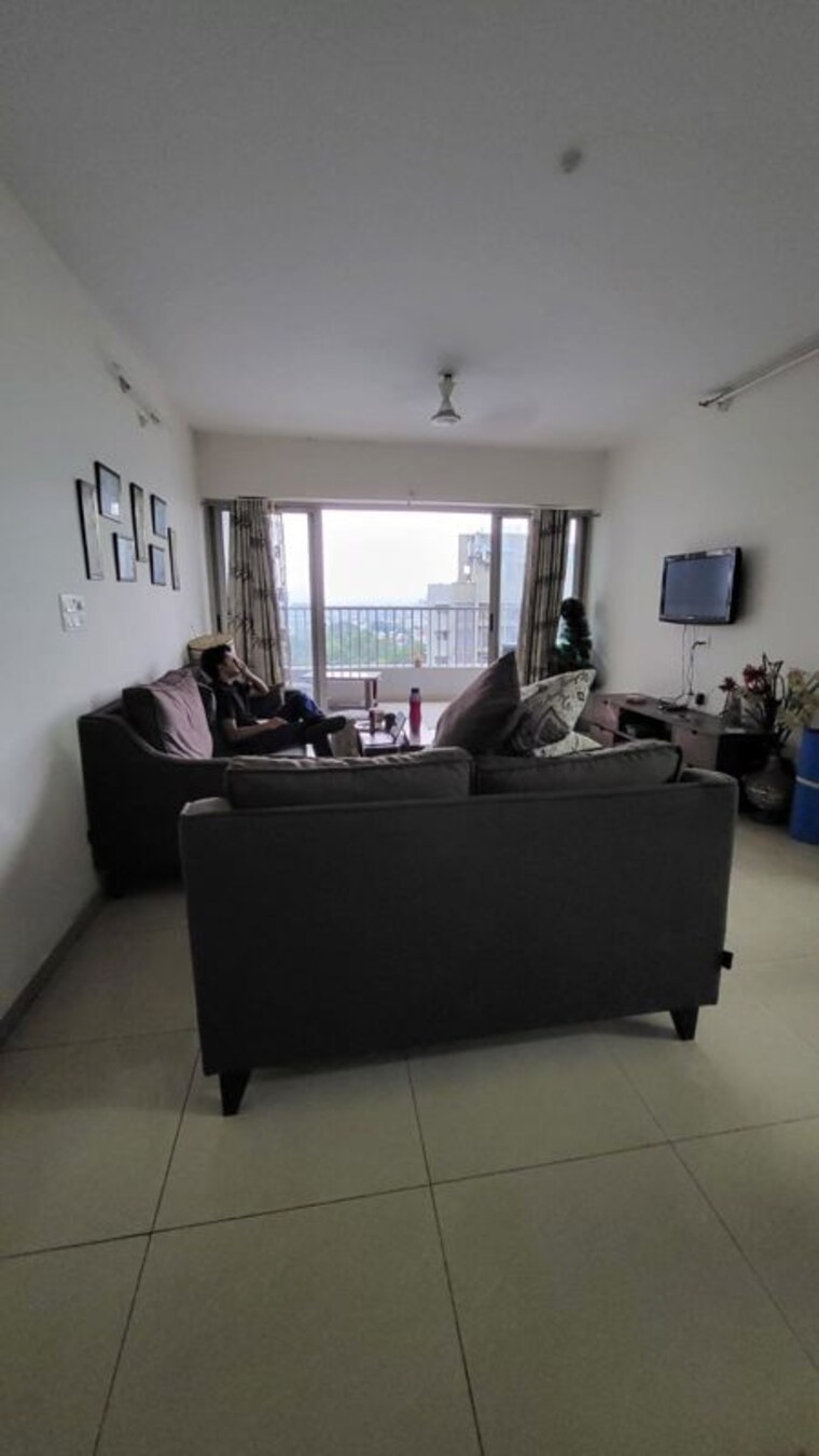 Living Room, amanora-adreno-towers 2 Bedroom 900 Sq.Ft. Apartment In Hadapsar Pune 10478143