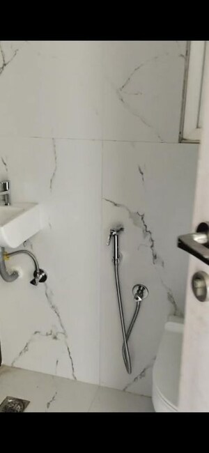Bathroom in 2 BHK Apartment at Ruparel Sky Green, Kandivali West – for Rent