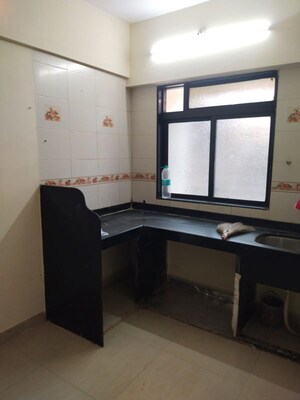 Kitchen in 1 BHK Apartment at Bombay Taximens CHS, Lbs Marg – for Rent