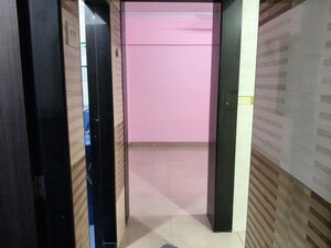 Building Lobby in 1 BHK Apartment at Habitat CHS, Nerul Sector 23 – for Rent