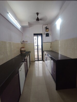 Kitchen in 2 BHK Apartment at Lalani Residency, Kavesar – for Rent