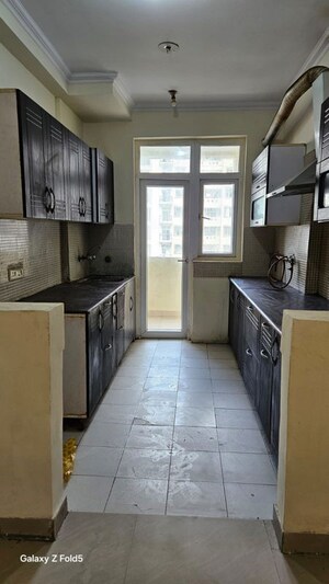 Kitchen in 3 BHK Apartment at Amrapali Silicon City, Sector 76 – for Rent