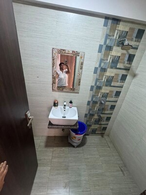 Bathroom in 2 BHK Apartment at Neminath Imperia, Andheri West – for Rent