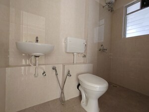 Bathroom in 1 BHK Apartment at Puranik City Reserva, Ghodbunder Road – for Rent
