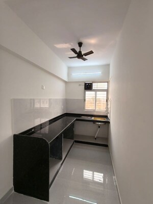 Kitchen in 1 BHK Apartment at Benchmark Greens Villa, Vangani – for Sale