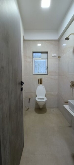 Bathroom in 2 BHK Apartment at Rander Komal Kounteya CHS, Borivali West – for Sale