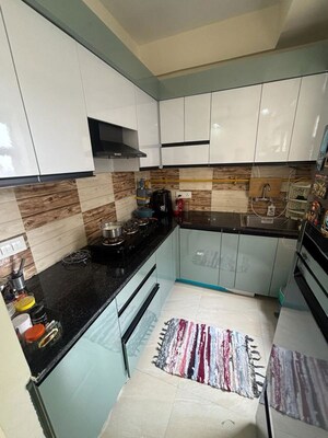Kitchen in 2 BHK Apartment at Amrapali Enchante, Tech Zone 4 Greater Noida – for Rent