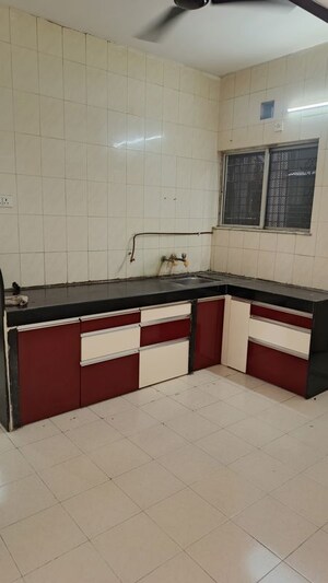 Kitchen in 2 BHK Apartment at Gangadham Apartment, Market Yard – for Rent