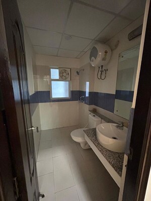 Bathroom in 1 RK Apartment at Pareena Om Apartments, Sector 112 – for Rent
