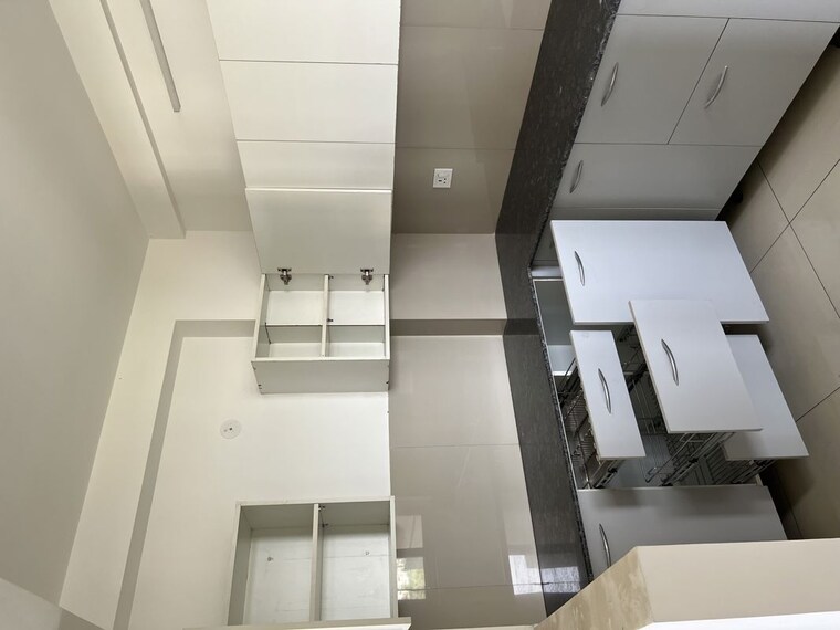 Kitchen, care-the-alien-court 2 Bedroom 1250 Sq.Ft. Apartment In Trans Delhi Signature City Ghaziabad 10482469