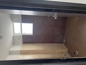 Washroom in 2 BHK Apartment at Care The Alien Court, Trans Delhi Signature City – for Rent