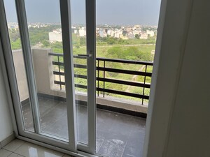 Balcony in 2 BHK Apartment at Care The Alien Court, Trans Delhi Signature City – for Rent