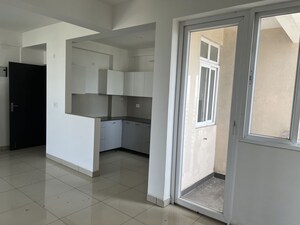 Utility Room in 2 BHK Apartment at Care The Alien Court, Trans Delhi Signature City – for Rent