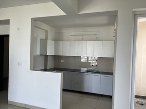 Kitchen in 2 BHK Apartment at Care The Alien Court, Trans Delhi Signature City – for Rent