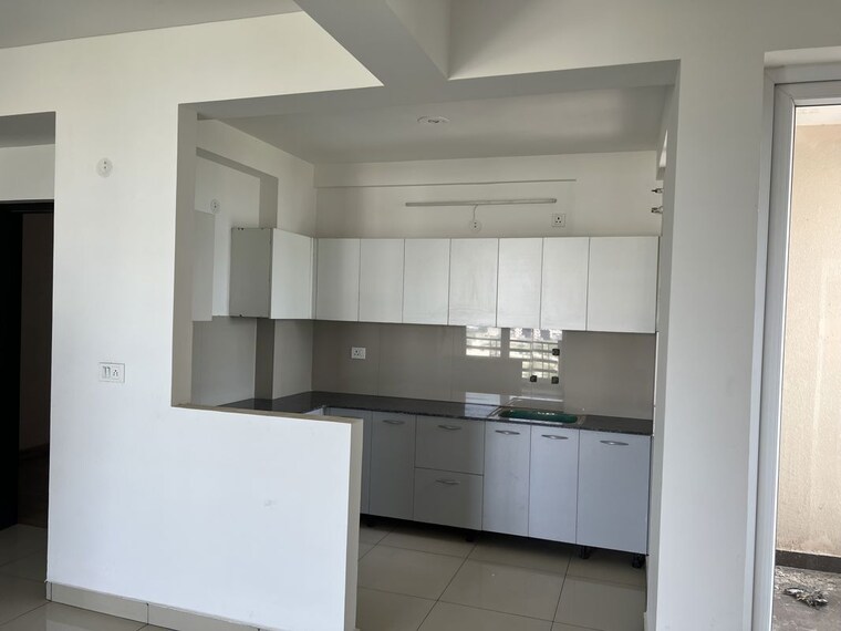 Kitchen, care-the-alien-court 2 Bedroom 1250 Sq.Ft. Apartment In Trans Delhi Signature City Ghaziabad 10482469