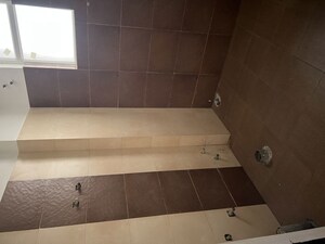 Bathroom in 2 BHK Apartment at Care The Alien Court, Trans Delhi Signature City – for Rent