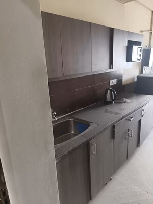 Kitchen in 1 RK Apartment at Paramount Golf Forest Studio Apartments - OAK Towe, Zeta I Greater Noida – for Rent