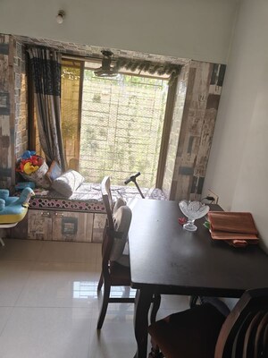 Living Room in 2 BHK Apartment at Shivraise Apartment, Kandivali East – for Rent