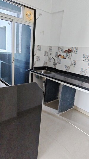 Kitchen in 1 BHK Apartment at Happy Valley, Manpada – for Rent