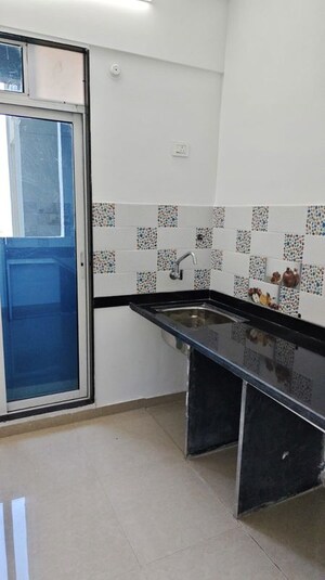 Kitchen in 2 BHK Apartment at Happy Valley, Manpada – for Rent