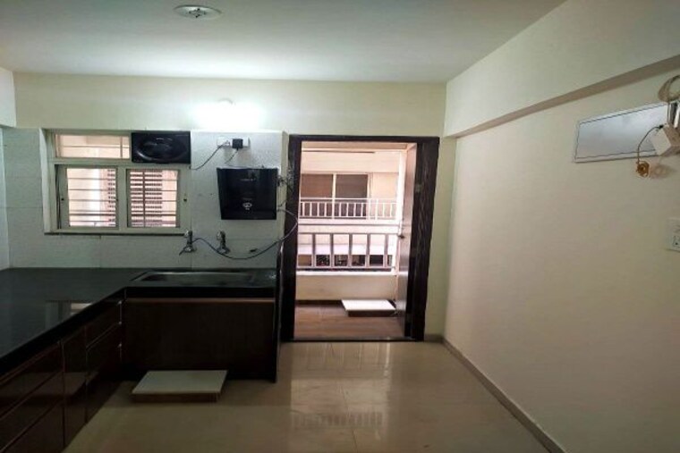 Kitchen, supertech-defence-colony-phase-iv 1 Bedroom 660 Sq.Ft. Apartment In Wagholi Pune 10482908