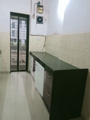 Kitchen in 2 BHK Apartment at Lalani Residency, Kavesar – for Rent