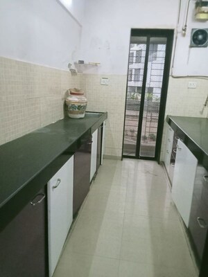 Kitchen in 2 BHK Apartment at Lalani Residency, Kavesar – for Rent