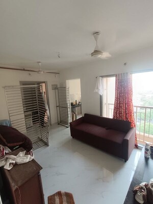 Living Room in 1 BHK Apartment at Metropolis Bayside, Kasarvadavali – for Rent