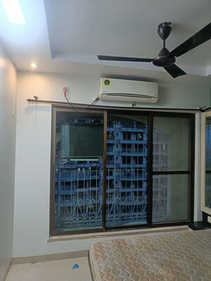 Living Room in 2 BHK Apartment at Tharwani Rosewood Heights, Kharghar Sector 10 – for Rent