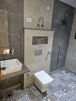 Bathroom in 3 BHK Builder Floor at Mansarover Garden – for Sale