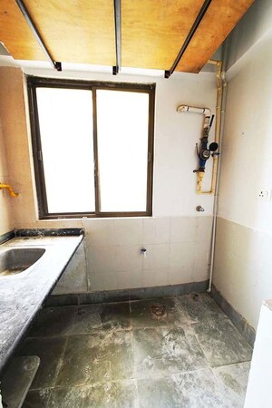 Kitchen in 2 BHK Apartment at Vaishnodevi Circle – for Sale