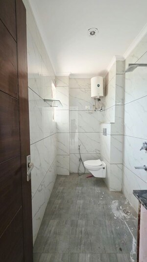 Bathroom in 4 BHK Builder Floor at Freedom Fighters Enclave – for Sale