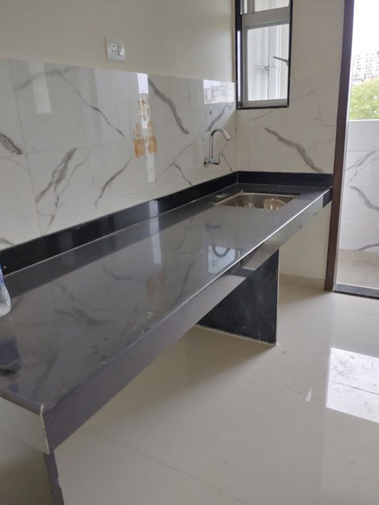 Kitchen, blue-27th-avenue 2 Bedroom 1000 Sq.Ft. Apartment In Bavdhan Pune 10485703