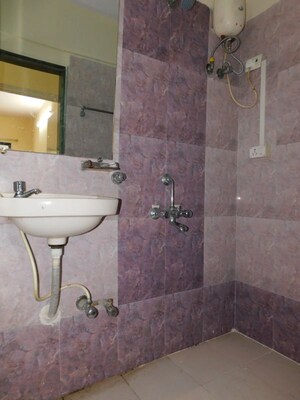 Bathroom in 3 BHK Apartment at Shivom Neela CHS, Mulund West – for Rent