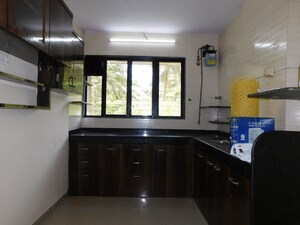 Kitchen in 3 BHK Apartment at Shivom Neela CHS, Mulund West – for Rent
